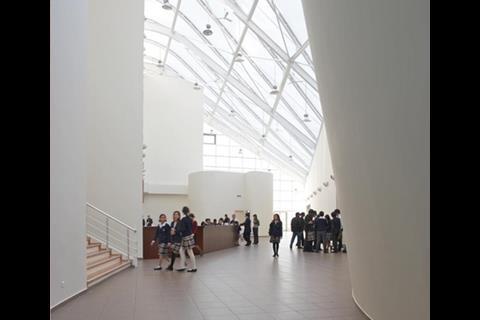 ETFE panels over the entrance atrium allow the room to fill with daylight